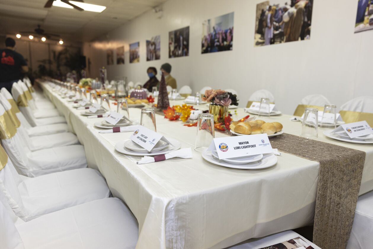 Dinnerware and decorations set up for Afghan refugees’ first Thanksgiving in America, Tuesday, Nov. 23, 2021, at Golden House Restaurant.